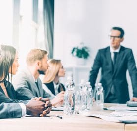 business people having a conversation in a conference room