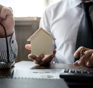 real estate agent making calculations for a client